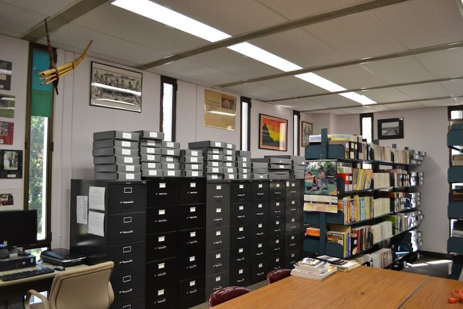 UC Irvine Southeast Asian Archive reading room with filing cabinets, archive boxes, and bookshelves