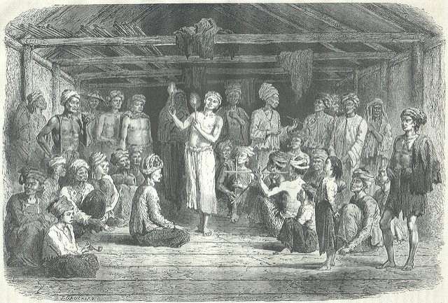 Antique engraving of a dancer holding candles before a seated crowd in a large open hall, musicians nearby