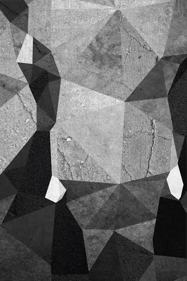 Black and white abstract pattern of angular polygon shapes over a cracked concrete texture.