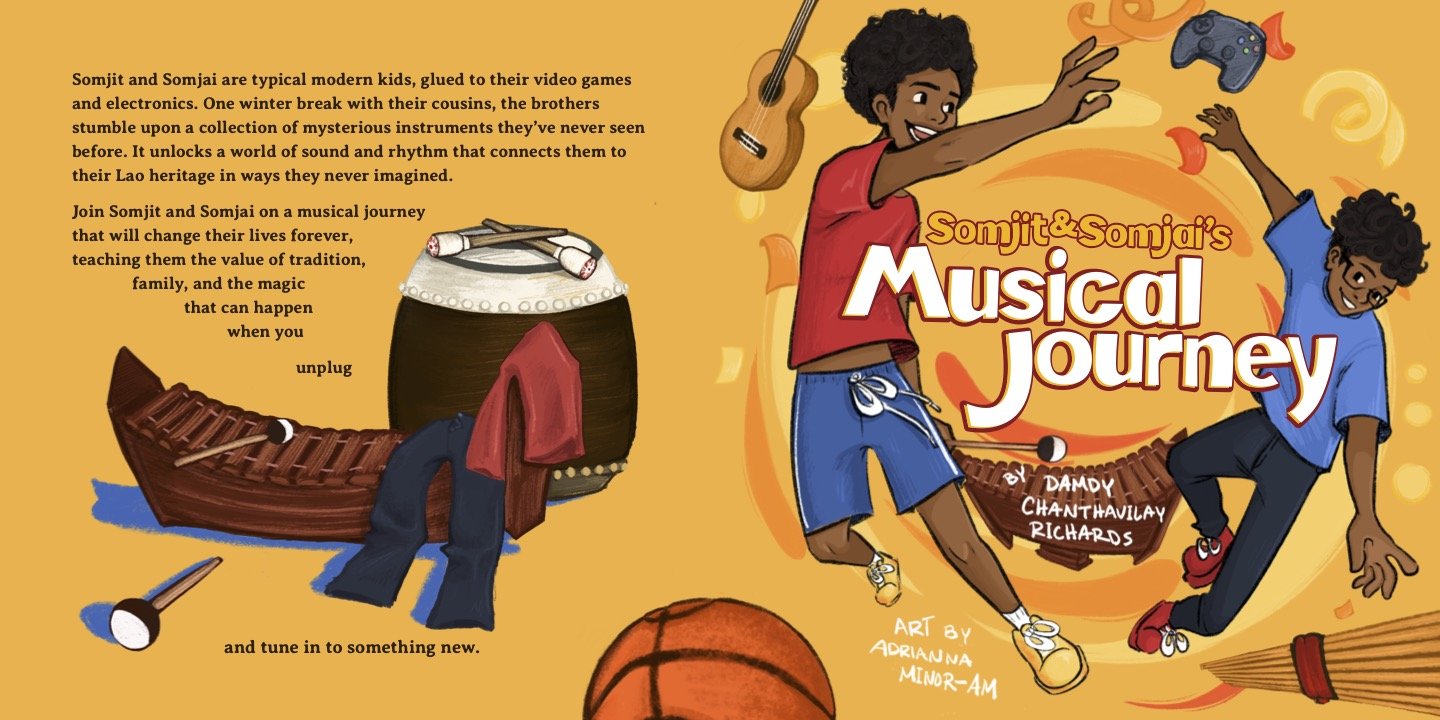Cover of Somjit & Somjai's Musical Journey by Damdy Chanthavilay Richards, art by Adrianna Ninh-Am, showing two boys leaping amid a guitar, game controller, and Lao instruments.