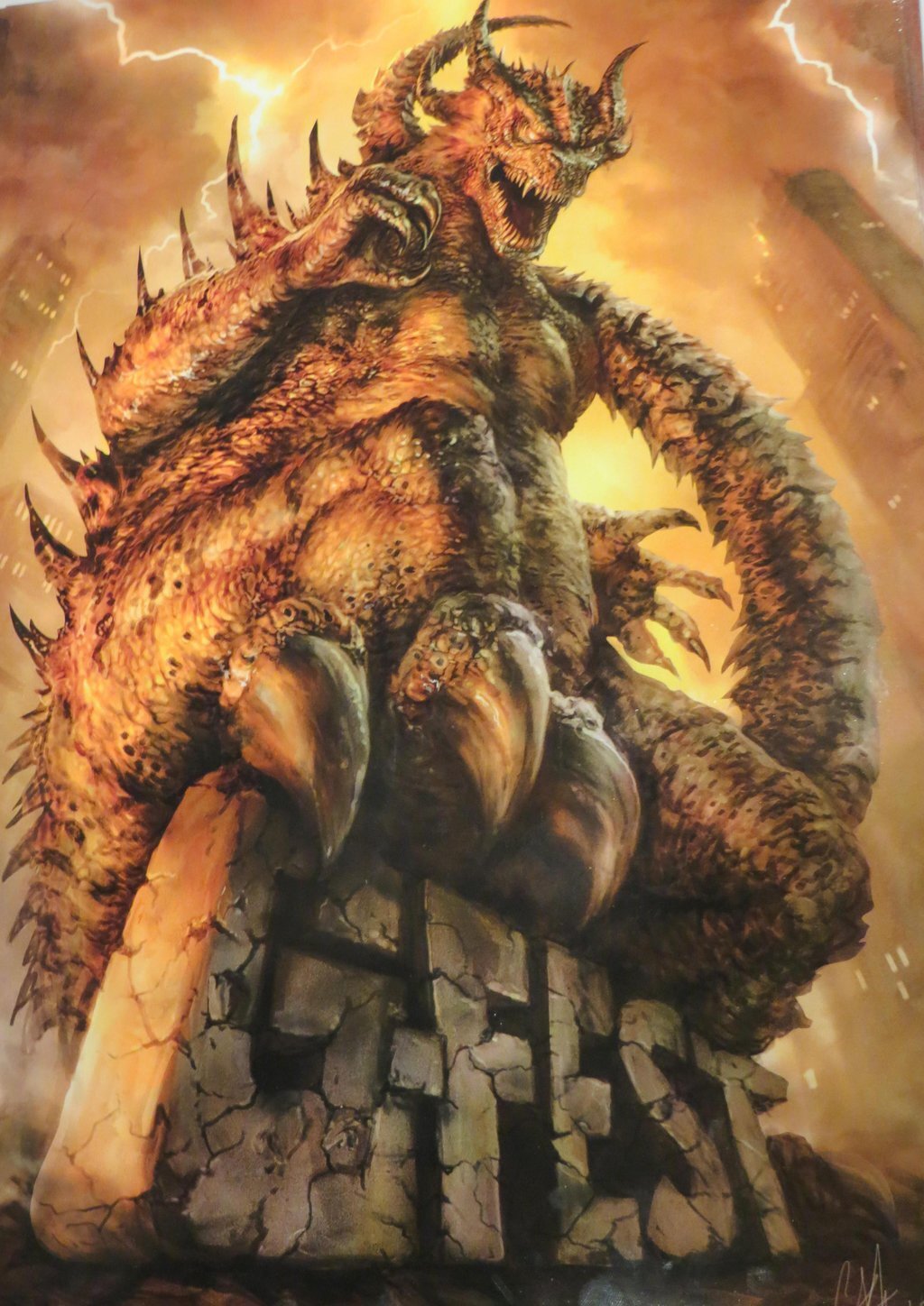 Painting of a horned, spiky golden kaiju roaring atop a crumbling stone G-Fest sign