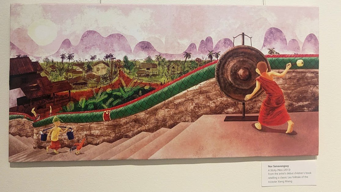 Illustration from A Sticky Mess by Nor Sanavongsay: a young monk strikes a temple gong beside a Nak balustrade overlooking a Lao village