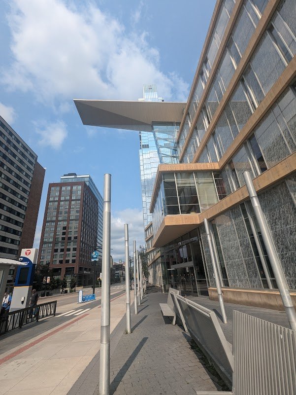 Glass and steel exterior of the Minneapolis Central Library on a sunny day