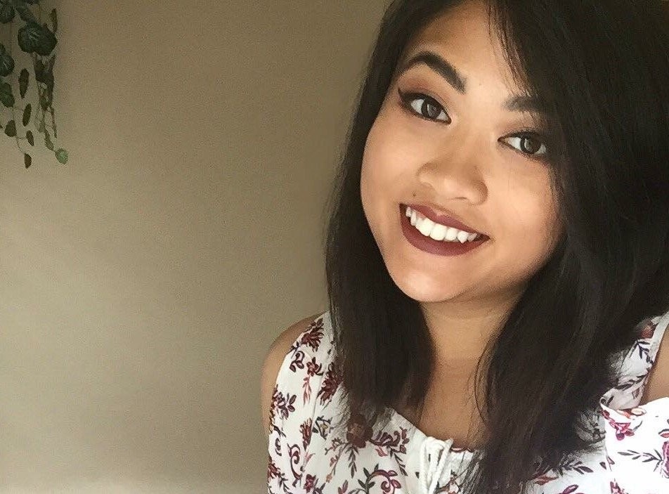 Smiling portrait of intern Savannah Rattanavong in a floral top.