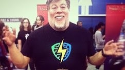 Madame Tussauds figure of Steve Wozniak, smiling with open arms at Silicon Valley Comic Con