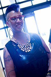 Linda D. Addison in red glasses and a statement necklace at an event