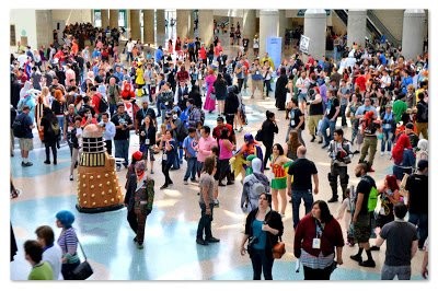 Crowd of attendees and cosplayers, including a Dalek, filling the lobby at WonderCon